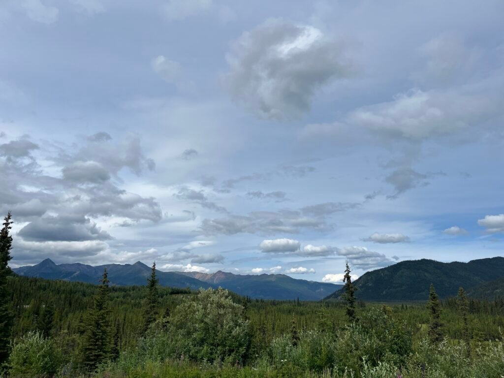 Mountains and a partially cloudy sky